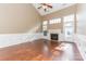 Spacious living room with a fireplace, high ceilings, and natural light at 165 N Arcadian Way, Mooresville, NC 28117