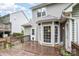 A cozy back deck features light gray siding, a charming bay window, and ample space for relaxing outdoors at 17318 Cambridge Grove Dr, Huntersville, NC 28078