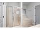 Bathroom with soaking tub, glass shower, and tiled floors at 17318 Cambridge Grove Dr, Huntersville, NC 28078