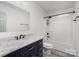 Clean, well-lit bathroom with vanity featuring a marble countertop and a tub-shower combo at 17318 Cambridge Grove Dr, Huntersville, NC 28078