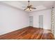 Expansive primary bedroom features hardwood floors, a tray ceiling, and two closets at 17318 Cambridge Grove Dr, Huntersville, NC 28078