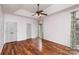 Large primary bedroom features hardwood floors, a tray ceiling, and two closets at 17318 Cambridge Grove Dr, Huntersville, NC 28078