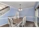 Dining room features a large table, chandelier, and is located near the staircase at 17318 Cambridge Grove Dr, Huntersville, NC 28078