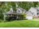 Traditional two-story home with landscaped front yard and an attached garage at 17318 Cambridge Grove Dr, Huntersville, NC 28078