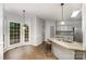 Bright kitchen with granite countertops, stainless steel appliances, and lots of windows at 17318 Cambridge Grove Dr, Huntersville, NC 28078