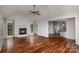 Spacious living room features hardwood floors, a fireplace, and lots of natural light at 17318 Cambridge Grove Dr, Huntersville, NC 28078