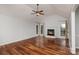 Large living room showcasing hardwood floors, a fireplace, and neutral color walls at 17318 Cambridge Grove Dr, Huntersville, NC 28078