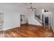 The living room features hardwood floors and connects to the foyer and kitchen at 17318 Cambridge Grove Dr, Huntersville, NC 28078