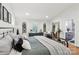 Serene bedroom with metal bed frame, hardwood floors, and stylish decorations at 1737 Hwy 109 N Hwy, Troy, NC 27371