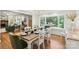 Inviting dining area with wood floors, a large window with natural light, and modern decor at 1737 Hwy 109 N Hwy, Troy, NC 27371