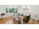 Bright dining room featuring chandelier, windows and view into backyard at 1737 Hwy 109 N Hwy, Troy, NC 27371