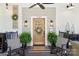 Cozy front porch with rocking chairs, stylish decor, and a welcoming entrance with a 'welcome' mat at 1737 Hwy 109 N Hwy, Troy, NC 27371