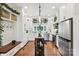 Bright kitchen featuring white cabinets, stainless steel appliances, and a butcher block island at 1737 Hwy 109 N Hwy, Troy, NC 27371