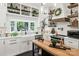 Modern kitchen boasting stainless appliances, butcher block island and white cabinetry at 1737 Hwy 109 N Hwy, Troy, NC 27371