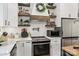 Modern kitchen with stainless oven, cabinetry, light countertops and wood accents at 1737 Hwy 109 N Hwy, Troy, NC 27371