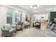 Welcoming living room with hardwood floors, shuttered windows, and a view into the dining room at 1737 Hwy 109 N Hwy, Troy, NC 27371