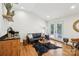 Inviting living room with hardwood floors, comfortable seating, and access to an outdoor patio at 1737 Hwy 109 N Hwy, Troy, NC 27371