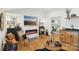 Cozy living room featuring hardwood floors, fireplace, and view to main bedroom at 1737 Hwy 109 N Hwy, Troy, NC 27371