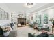 Comfortable living room with stone fireplace, built-in shelves, and abundant natural light at 1737 Hwy 109 N Hwy, Troy, NC 27371