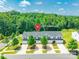 Aerial view of townhouses in a wooded area, showing driveways and landscaping at 2009 Talbert Ct, Charlotte, NC 28214