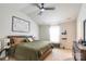 Carpeted main bedroom featuring a ceiling fan and a queen-sized bed at 2009 Talbert Ct, Charlotte, NC 28214