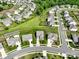 Aerial view of a residential neighborhood with green spaces and well-maintained homes at 2178 Stone Pile Sw Dr, Concord, NC 28025