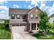 Charming two-story brick home featuring a two-car garage and well-manicured front lawn at 2178 Stone Pile Sw Dr, Concord, NC 28025