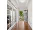 Bright foyer with hardwood floors, elegant trim, and a view of the front yard through the open front door at 2178 Stone Pile Sw Dr, Concord, NC 28025