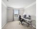 Well-lit home office with a desk, comfortable chair, and bright window at 2178 Stone Pile Sw Dr, Concord, NC 28025
