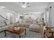 Spacious open-concept living room with hardwood floors and access to kitchen at 2178 Stone Pile Sw Dr, Concord, NC 28025