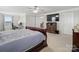 Spacious main bedroom with carpet, tv, and ceiling fan at 2178 Stone Pile Sw Dr, Concord, NC 28025
