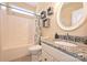 Bathroom featuring granite countertops, a shower-tub, and decorative shelves at 2300 Lord Anson Dr, Waxhaw, NC 28173