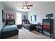 Shared bedroom with two twin beds and sports themed decor, a ceiling fan, and neutral carpet at 2300 Lord Anson Dr, Waxhaw, NC 28173