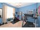A well-lit bedroom featuring exercise equipment, a ceiling fan, and colorful decor at 2300 Lord Anson Dr, Waxhaw, NC 28173