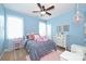 Bedroom features light blue walls, white furniture, soft pink accents, a ceiling fan, and natural light at 2300 Lord Anson Dr, Waxhaw, NC 28173