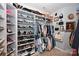 Walk-in closet with extensive shelving and hanging storage for shoes and clothing at 2300 Lord Anson Dr, Waxhaw, NC 28173