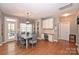 Bright dining area with wood floors, pendant lighting, and a functional built-in desk area at 2300 Lord Anson Dr, Waxhaw, NC 28173