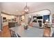 Dining room leading into living room and kitchen with hardwood floors throughout at 2300 Lord Anson Dr, Waxhaw, NC 28173