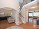 Spacious foyer with hardwood floors, staircase, and access to living areas at 2300 Lord Anson Dr, Waxhaw, NC 28173