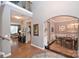 Grand foyer with hardwood floors, a staircase, and an elegant chandelier at 2300 Lord Anson Dr, Waxhaw, NC 28173
