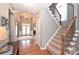 Inviting foyer with hardwood floors, staircase, and double front doors at 2300 Lord Anson Dr, Waxhaw, NC 28173