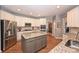 Bright kitchen featuring granite countertops, stainless steel appliances, and a center island at 2300 Lord Anson Dr, Waxhaw, NC 28173