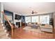 Inviting living room with a fireplace, hardwood floors, and large windows at 2300 Lord Anson Dr, Waxhaw, NC 28173