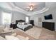 Large main bedroom with tray ceilings, ceiling fan, and neutral decor at 2300 Lord Anson Dr, Waxhaw, NC 28173