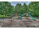 Community playground with slides and climbing structures for enjoyment at 2300 Lord Anson Dr, Waxhaw, NC 28173