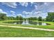 Picturesque pond with a fountain feature, bordered by lush greenery at 2300 Lord Anson Dr, Waxhaw, NC 28173