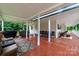 Large covered back deck with seating, grilling area and outdoor features at 2451 Reepsville Rd, Lincolnton, NC 28092