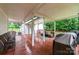 View of the covered back deck with seating area and grill at 2451 Reepsville Rd, Lincolnton, NC 28092
