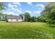 Expansive backyard with lush green grass and mature trees, perfect for outdoor activities at 2451 Reepsville Rd, Lincolnton, NC 28092