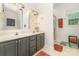 Bathroom featuring a double sink vanity, a framed mirror, and a walk-in shower at 2451 Reepsville Rd, Lincolnton, NC 28092
